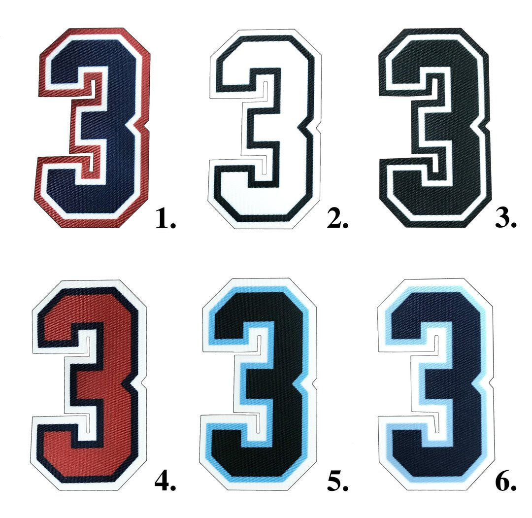 Collection of durable umpire numbers in various sizes and colors, designed for clear visibility and professional appearance on the field