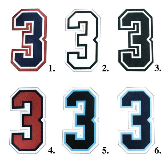 Collection of durable umpire numbers in various sizes and colors, designed for clear visibility and professional appearance on the field